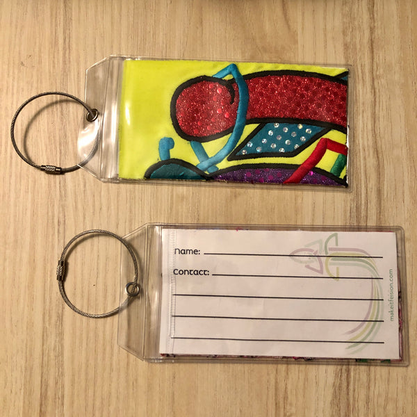 yellow multi luggage tags