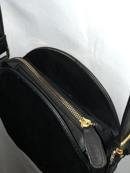 black round crossbody handbag